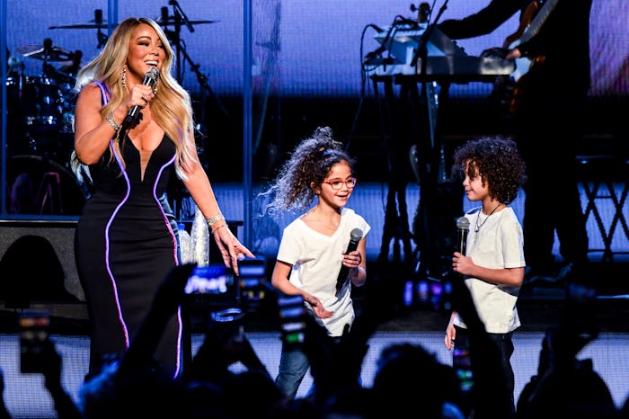 Mariah Carey performs onstage with Monroe Cannon and Moroccan Cannon.