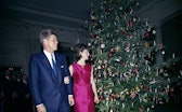 12 December 1962 President and Mrs. Kennedy make an appearance at the White House Staff Christmas Pa...