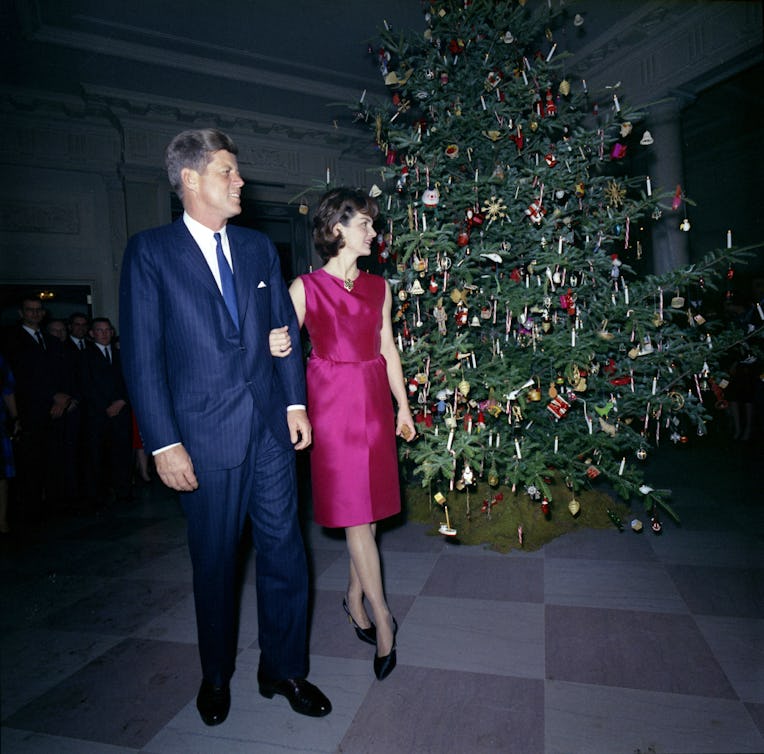 12 December 1962 President and Mrs. Kennedy make an appearance at the White House Staff Christmas Pa...