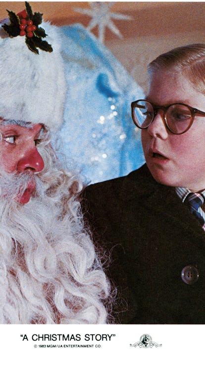 Peter Billingsley sits on Santa's lap in a scene from the film 'A Christmas Story', 1983. (Photo by ...