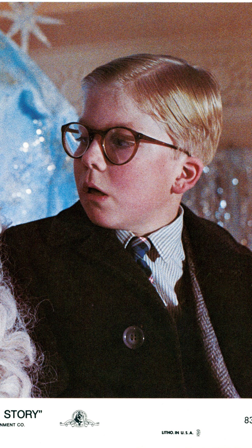 Peter Billingsley sits on Santa's lap in a scene from the film 'A Christmas Story', 1983. (Photo by ...