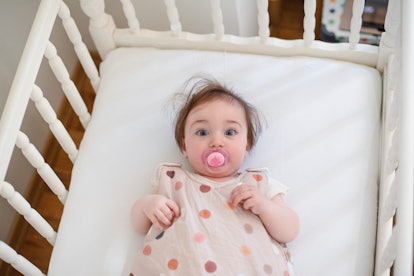 a baby put down drowsy but awake in an article about cry it out method of sleep training