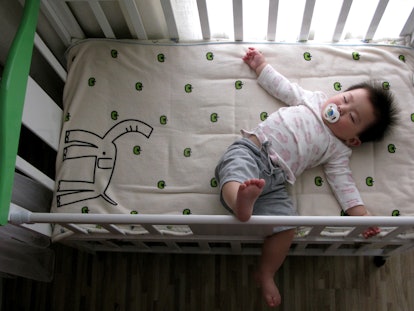 a sleeping baby in an article about the cry it out method of sleep training