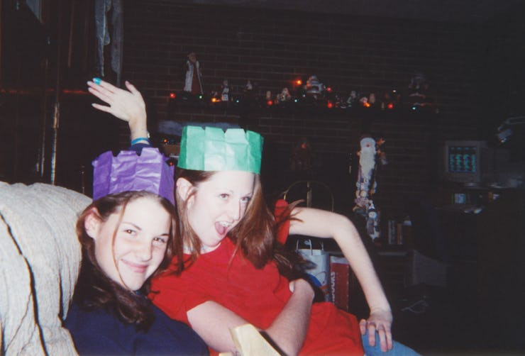 Best friends celebrating at a holiday party. Two friends having fun during the holidays and wearing ...