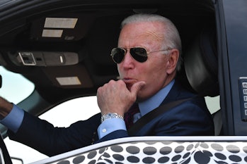 US President Joe Biden drives the new electric Ford F-150 Lightning at the Ford Dearborn Development...