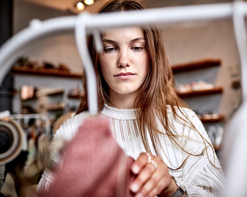 woman shopping, aries 2023 horoscope about money, career, family, and love