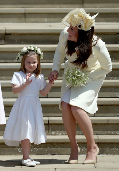 WINDSOR, UNITED KINGDOM - MAY 19:  Princess Charlotte of Cambridge stands on the steps with her moth...