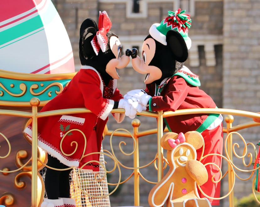 Disney characters Mickey and Minnie Mouse perform on the float during a parade for Christmas at the ...