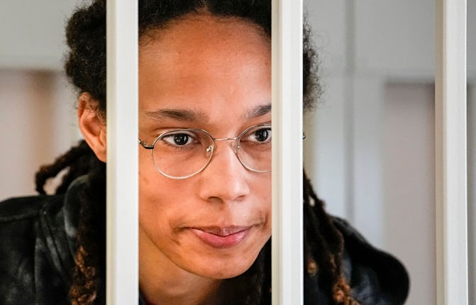 US WNBA basketball superstar Brittney Griner looks from inside a defendants' cage before a hearing a...