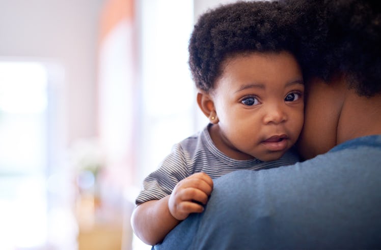 Cropped shot of a baby girl being held by her mother