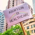 Abortion Is Healthcare sign. The AP Style Guide has advised journalists not to use the terms "fetal ...
