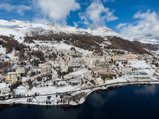 Aerial view of the famous St Moritz village and lake on a sunny winter day in the alps in Canton Gra...