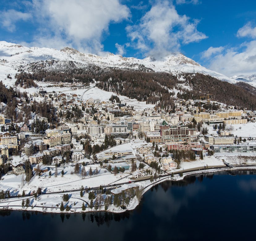 Aerial view of the famous St Moritz village and lake on a sunny winter day in the alps in Canton Gra...