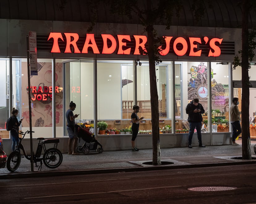 exterior of trader joe's store at night in an article about trader joe's 2022 christmas hours