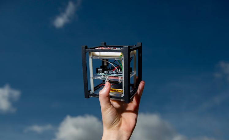 IRVINE, CA - MARCH 14: A model of the CubeSat satellite that is similar to the miniature satellite t...