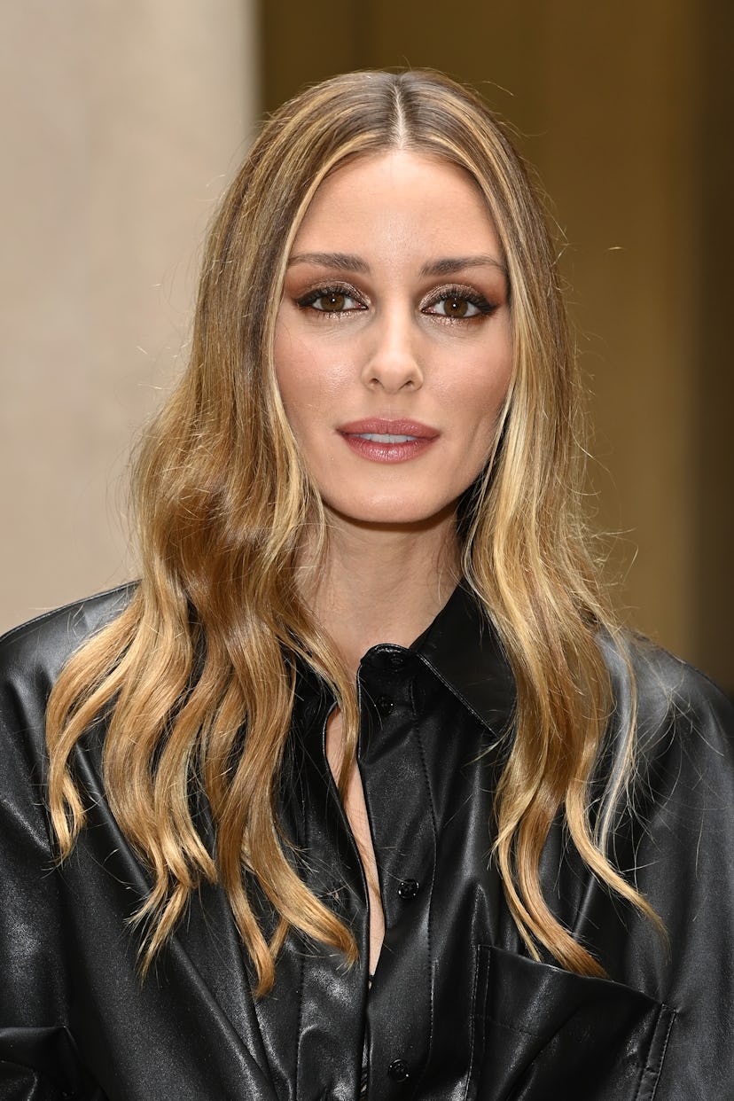 Olivia Palermo with golden blonde highlights on brown hair.