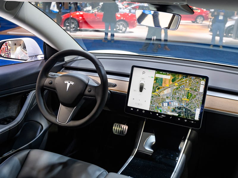 BRUSSELS, BELGIUM - JANUARY 9: Tesla Model 3 compact full electric car interior with a large touch s...