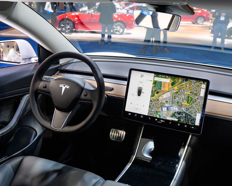 BRUSSELS, BELGIUM - JANUARY 9: Tesla Model 3 compact full electric car interior with a large touch s...