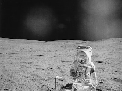 American NASA astronaut Edgar Mitchell (1930-2016) and the Modular Equipment Transporter on the luna...