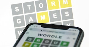 Wordle game displayed on a phone and a laptop screens is seen in this illustration photo taken in Kr...