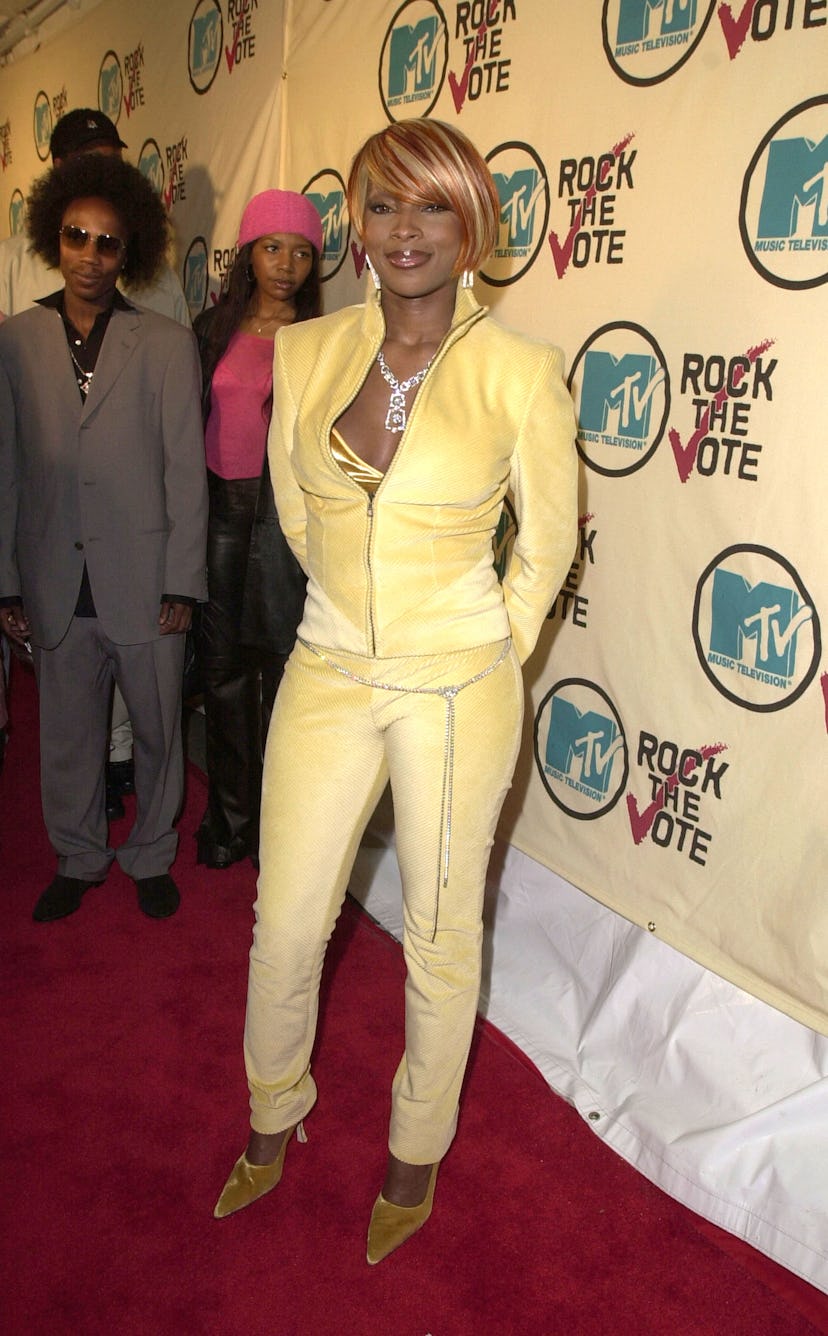 Mary J. Blige at a Rock the Vote event in an all yellow outfit in 2001.