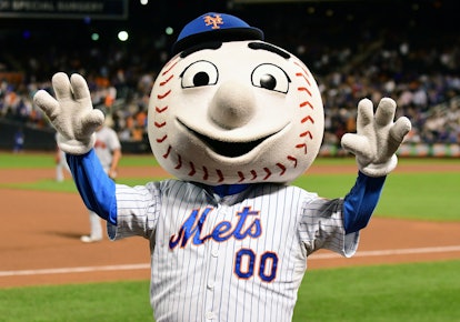FLUSHING, NY - SEPTEMBER 26: New York Mets mascot Mr Met riles up the crowd during a MLB game betwee...