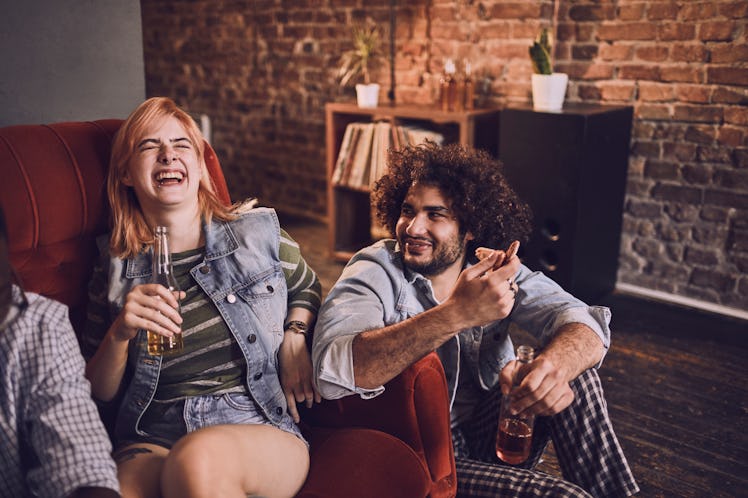 A group of friends having pizza and beer together would need Super Bowl 2022 captions for Instagram ...