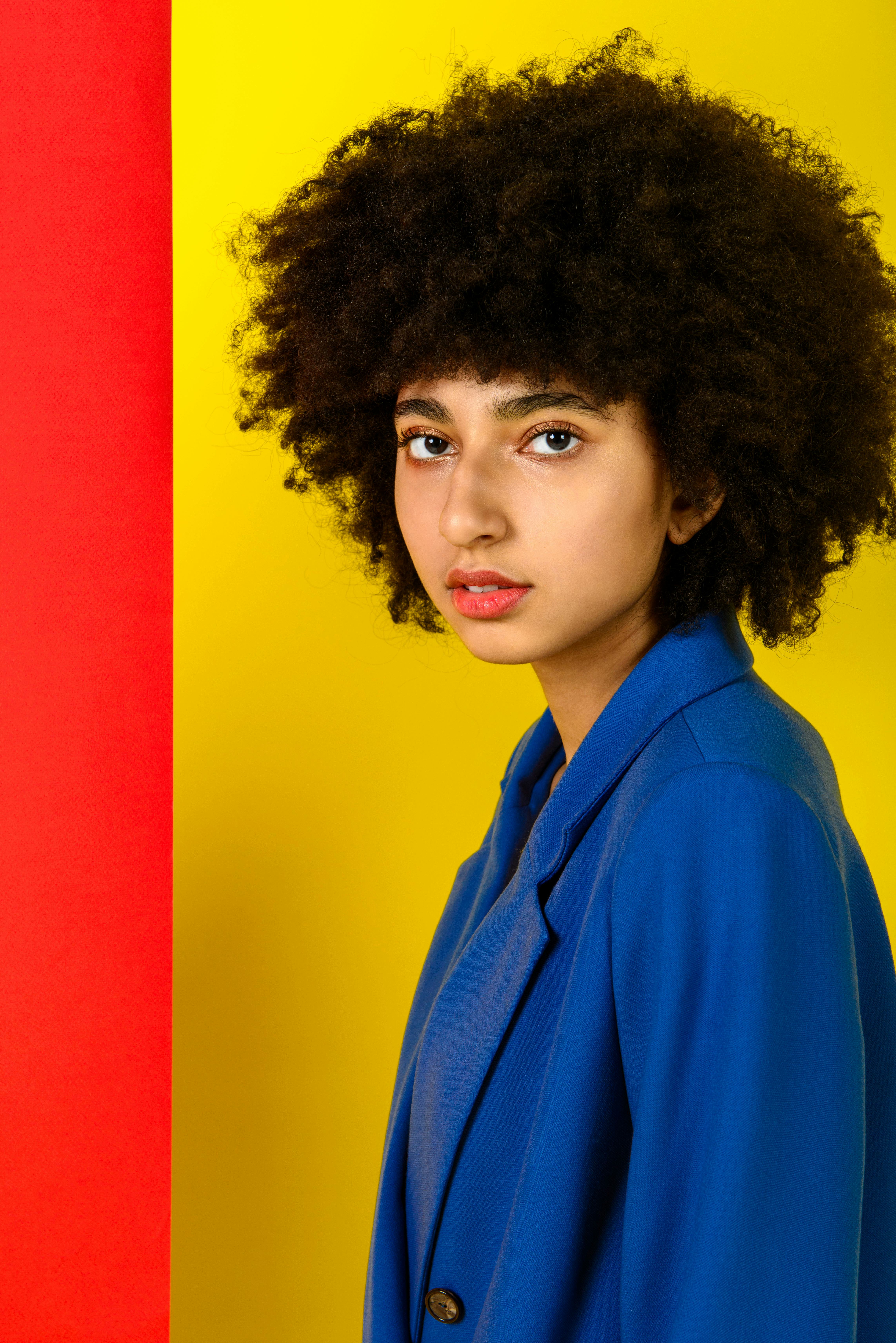 young woman looking into camera as she thinks about the zodiac signs most likely to get into a fight...