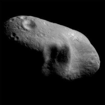 385446 01: FILE PHOTO: An image mosaic of the asteroid Eros, with sunlight coming from the northeast...