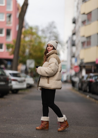 Anja Balovneva matched her beige beanie to her puffer jacket and boots on October 25, 2021 in Cologn...