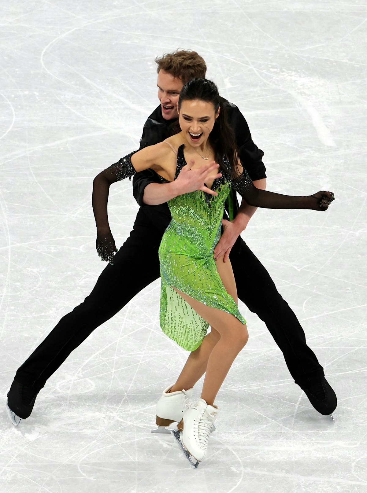 BEIJING, CHINA - FEBRUARY 12: Madison Chock and Evan Bates of Team United States react after skating...