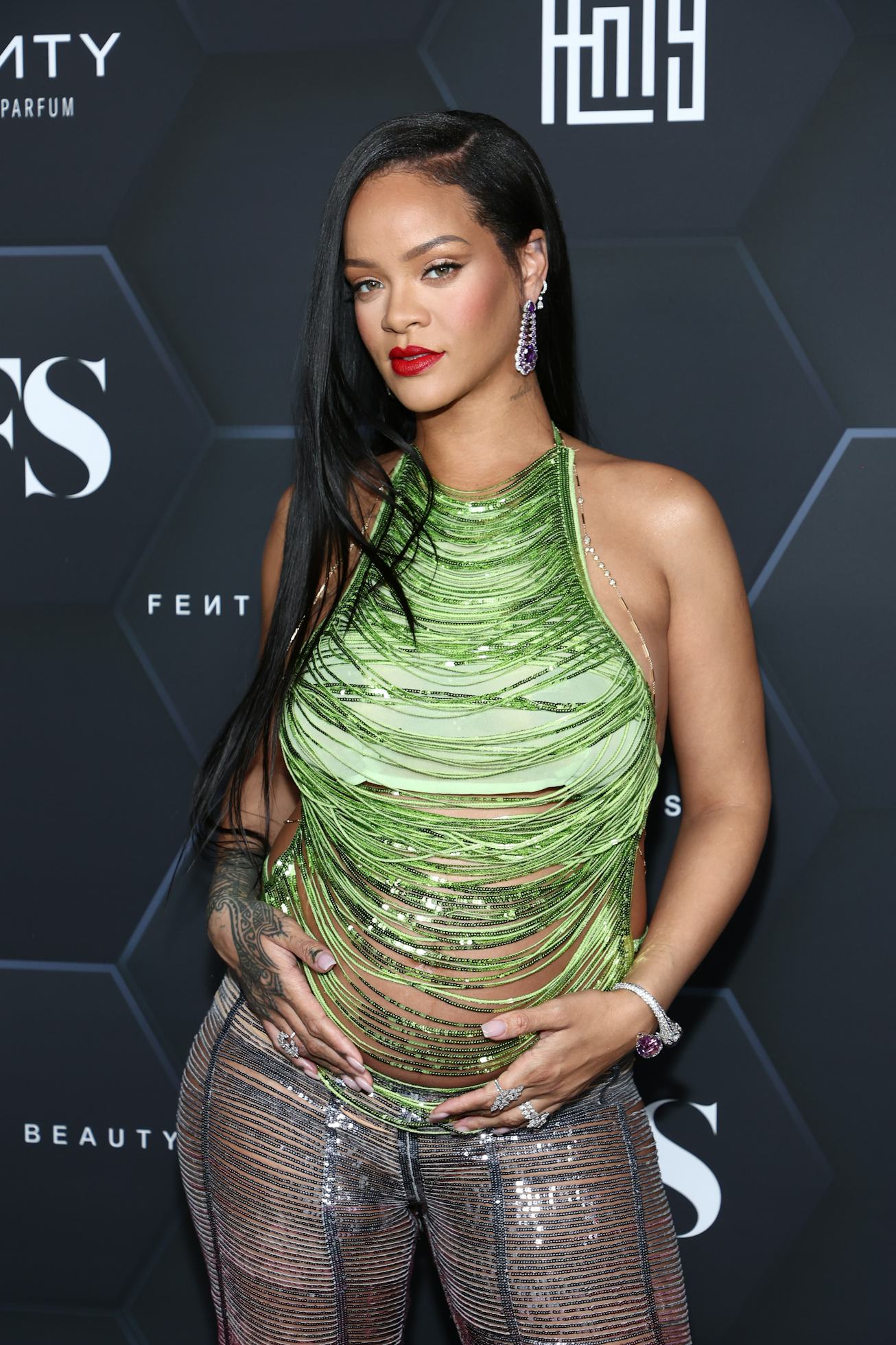 LOS ANGELES, CALIFORNIA - FEBRUARY 11: Rihanna poses for a picture as she celebrates her beauty bran...