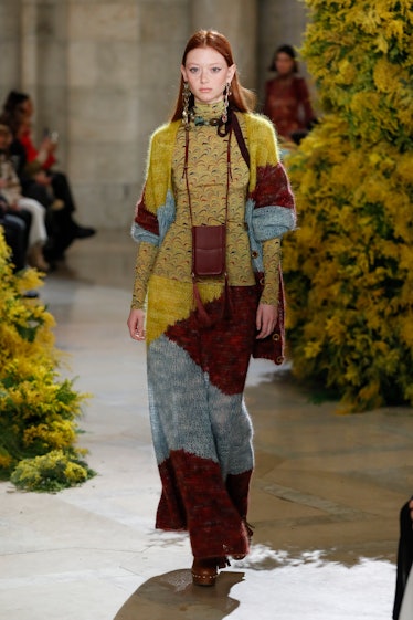 Model on the NY Fashion Week Fall 2022 runway in Ulla Johnson colorful crochet sweater and skirt wit...