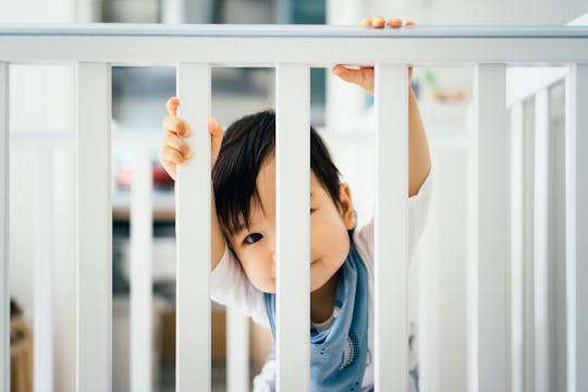 Here's how to keep your baby from sticking their legs through the crib.