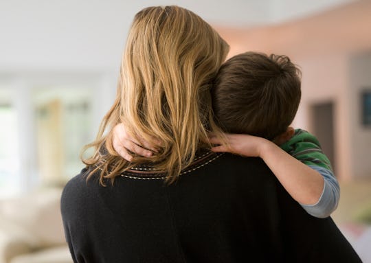 mom and son hugging