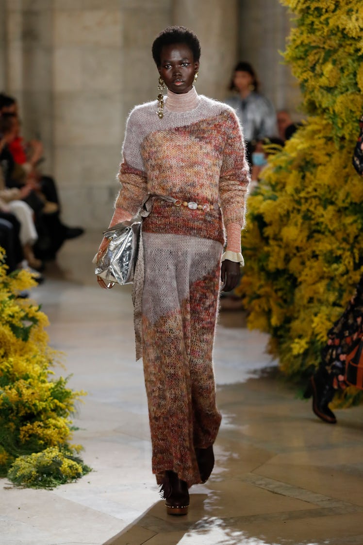 Model on the NY Fashion Week Fall 2022 runway in Ulla Johnson colorful crochet sweater, pants, and s...