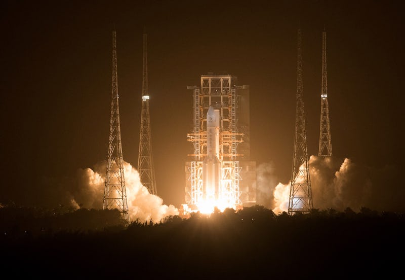 WENCHANG, Nov. 24, 2020 -- A Long March-5 rocket, carrying the Chang'e-5 spacecraft, blasts off from...