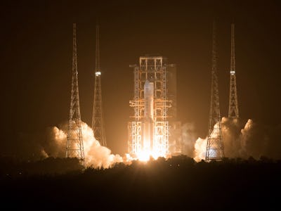 WENCHANG, Nov. 24, 2020 -- A Long March-5 rocket, carrying the Chang'e-5 spacecraft, blasts off from...