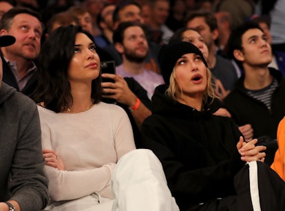 Kendall Jenner and Hailey Baldwin attend the game between the New York Knicks and the Los Angeles Cl...