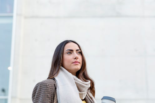 woman in a cozy outfit with her coffee