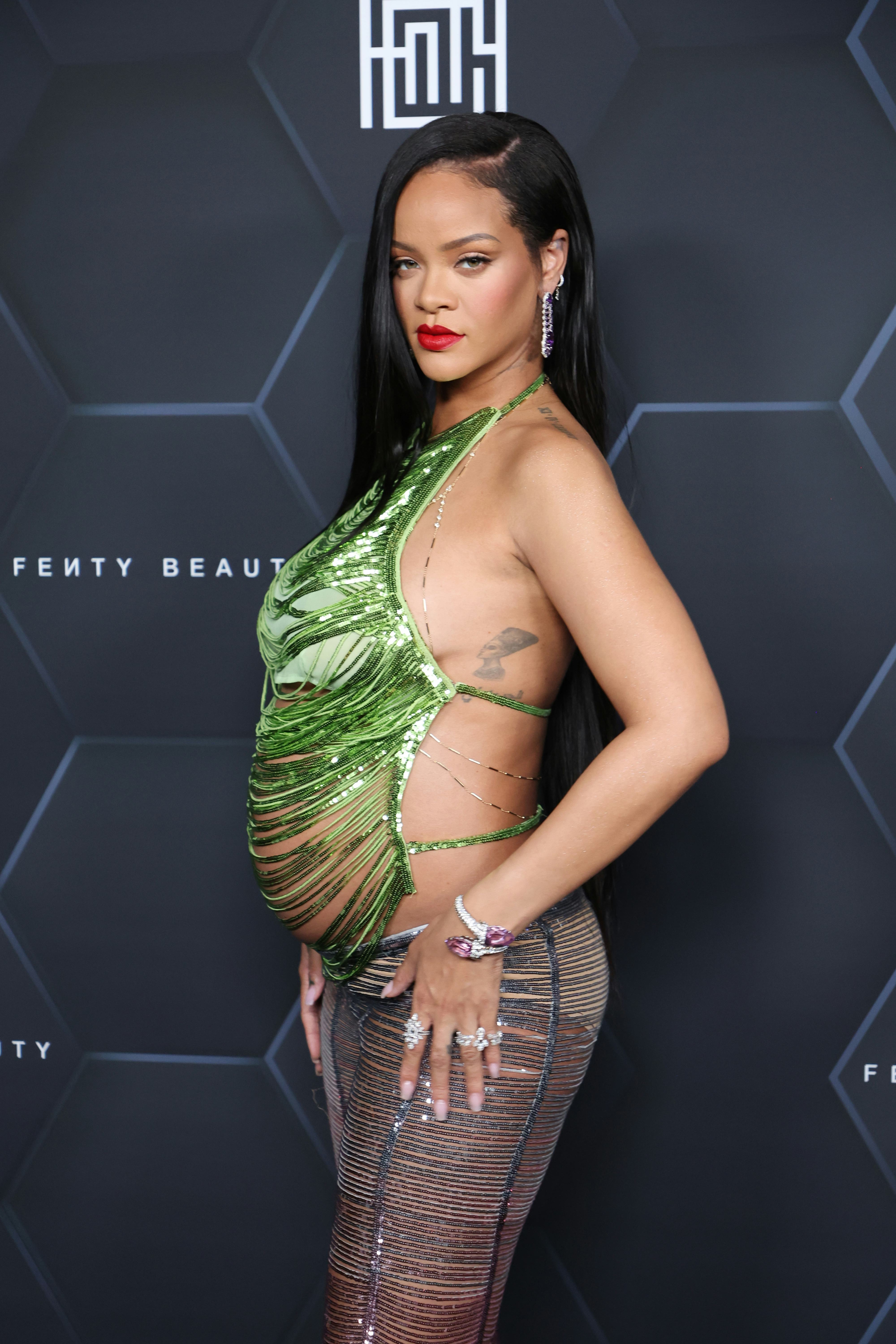 LOS ANGELES, CALIFORNIA - FEBRUARY 11: Rihanna poses for a picture as she celebrates her beauty bran...