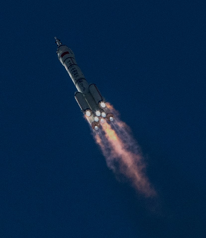 JIUQUAN, CHINA - JUNE 17: The manned Shenzhou-12 spacecraft from China's Manned Space Agency onboard...