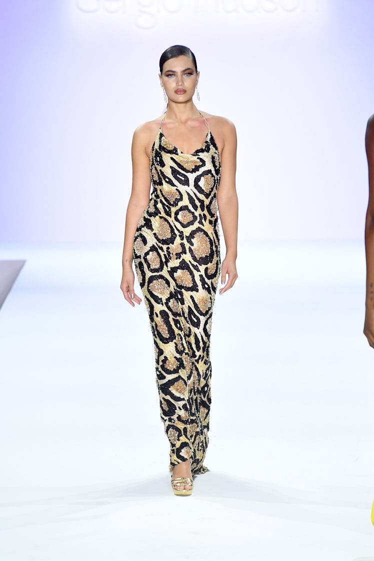 A model walking the runway in a leopard print slip dress by Sergio Hudson during New York Fashion We...
