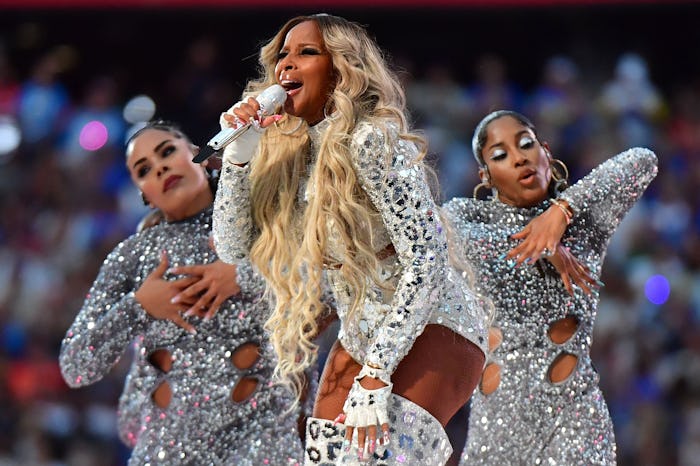 US singer-songwriter Mary J. Blige (C) performs during the halftime show of Super Bowl LVI between t...