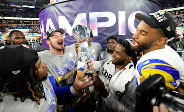 Inglewood, CA - February 13: Los Angeles Rams players celebrate with the trophy after the Rams defe...