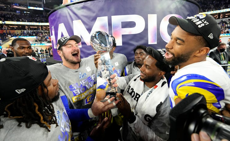 Inglewood, CA - February 13: Los Angeles Rams players celebrate with the trophy after the Rams defe...