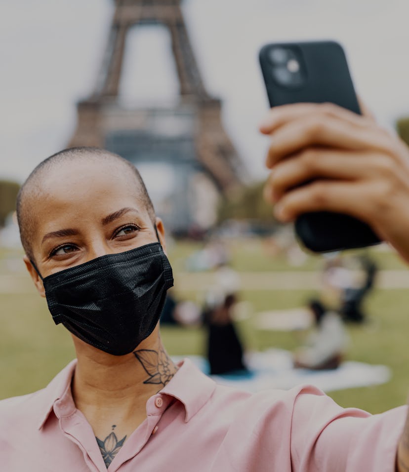 Portrait of mixed race woman with phone