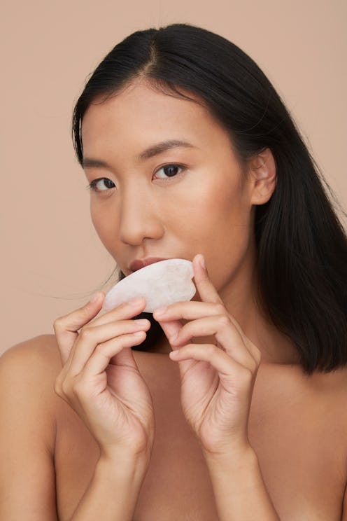 How to use gua sha for jawline sculpting, according to experts.