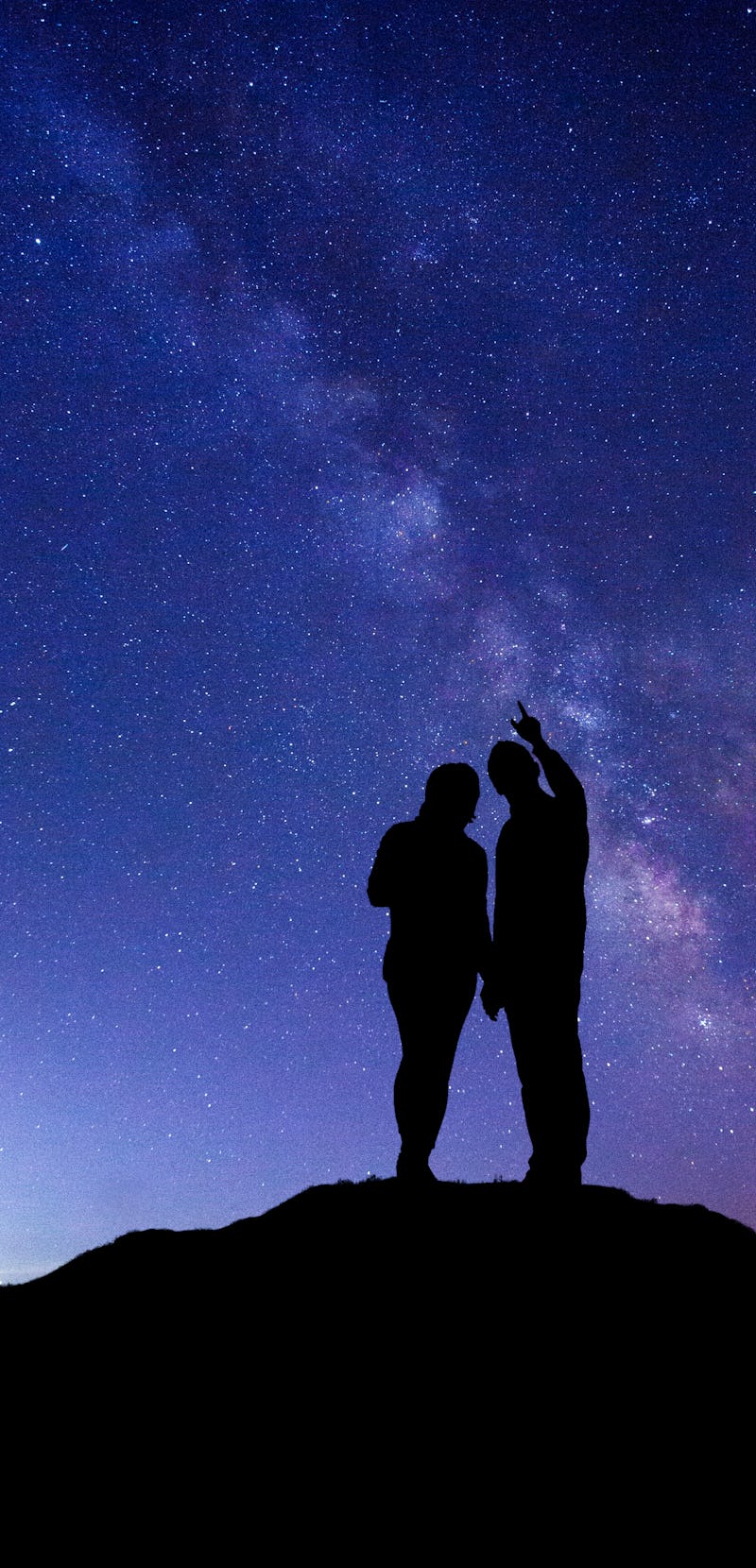 A couple gazing up at the stars 