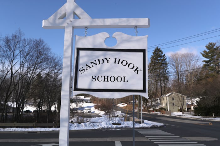 SANDY HOOK, CT - MARCH 14:  A sign stands near the site of the December 2012 Sandy Hook school shoot...